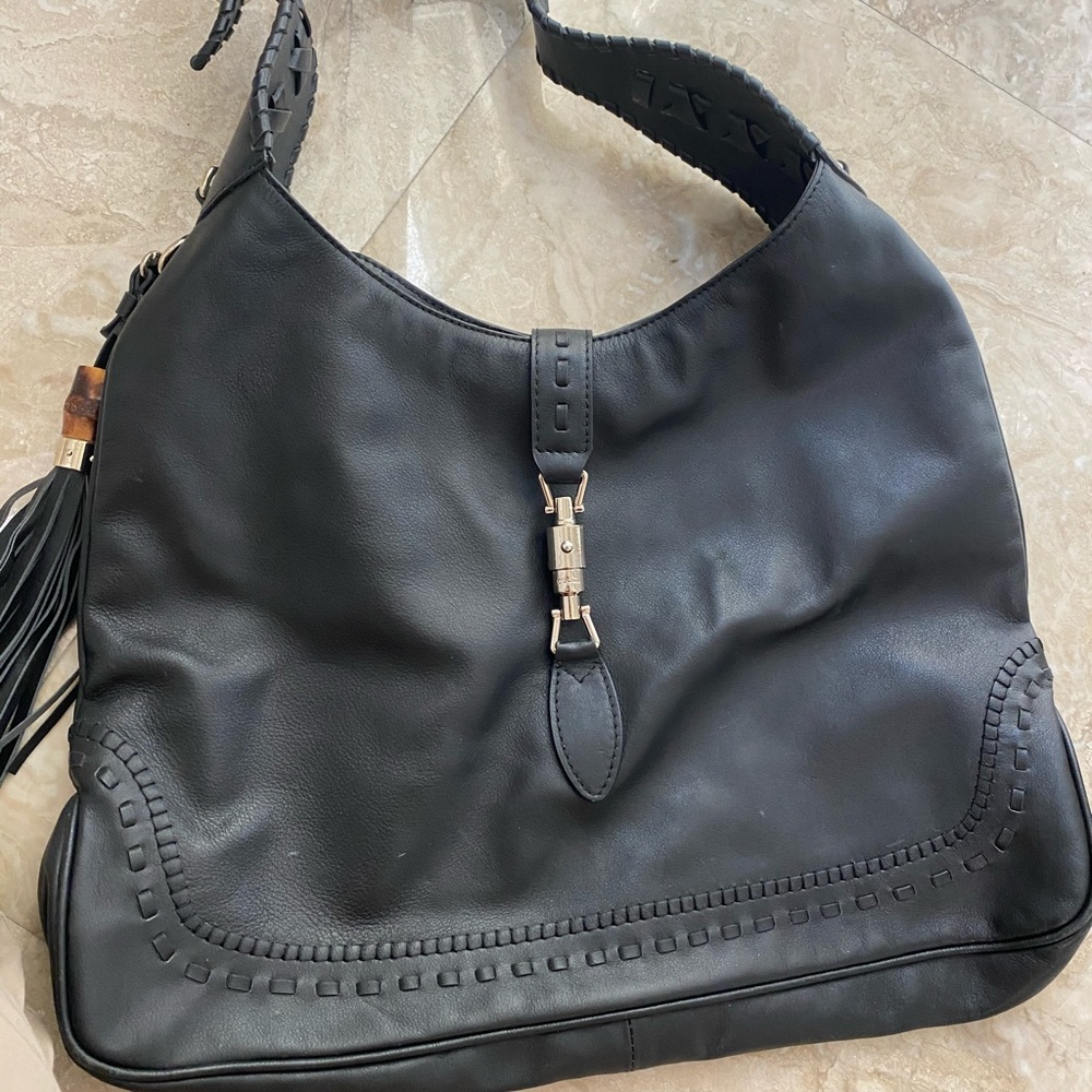 Black leather shoulder bag gently used